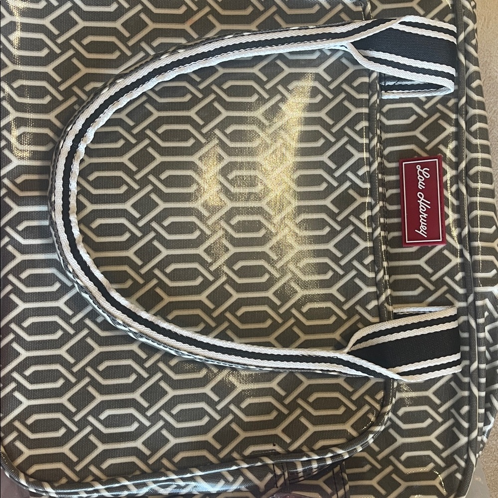 Vinyl coated fabric tote with geo design.